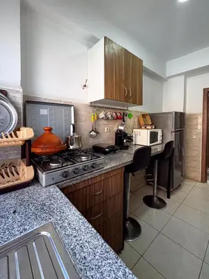 a kitchen with a stove and a counter top at Apartment in Marrakech near McDonald's Massira in Marrakech