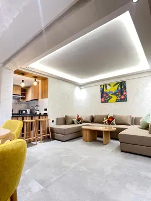a living room with a couch and a table at MayyRakech in Marrakech