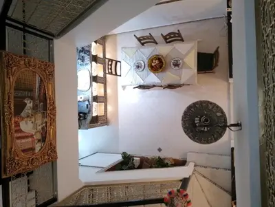 a bathroom with a mirror and a sink at Riad Alhana in Marrakech