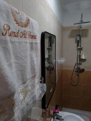 a bathroom with a towel that reads randall oil firm at Riad Alhana in Marrakech