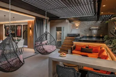 a living room with swing chairs and a couch at Luxury 3 bedroom with private pool and spa in Marrakech