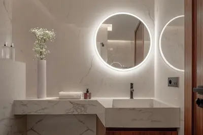 a bathroom with a sink and a mirror at Luxury 3 bedroom with private pool and spa in Marrakech