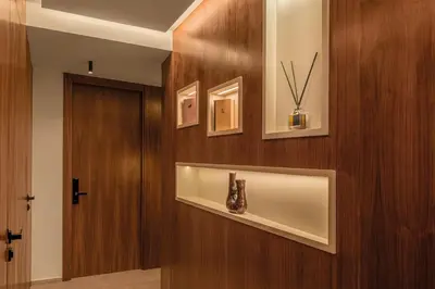 a hallway with a door and a vase on a shelf at Luxury 3 bedroom with private pool and spa in Marrakech