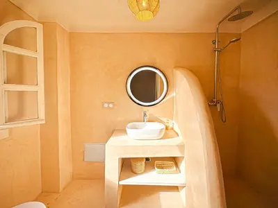 a bathroom with a sink and a mirror at Riad Medina Luxury Charm in Marrakech