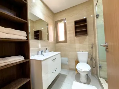 a bathroom with a toilet and a sink and a shower at Prestigia 3 Bedrooms witch pool and Garden in Marrakech
