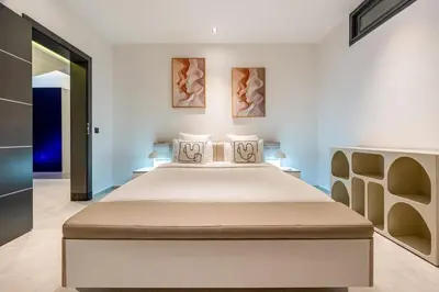 a bedroom with a large bed in a room at villa golfe in Marrakech