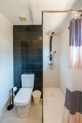 a bathroom with a toilet and a shower at villa golfe in Marrakech