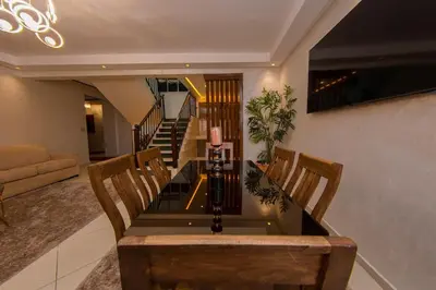a dining room table and chairs in a living room at Duplex familiale au centee du Marrakech in Marrakech