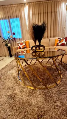 a glass coffee table in a living room at Duplex familiale au centee du Marrakech in Marrakech
