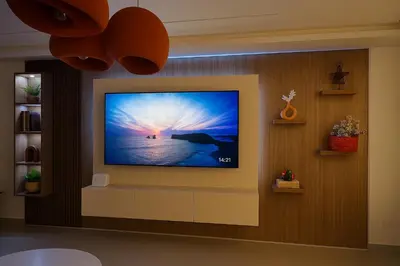 a flat screen tv hanging on a wall at Aube d hivernage Marrakech in Marrakech