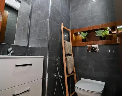 a bathroom with a toilet and a sink at Downtown Prestige 2Br apartment cinema AC in Marrakech