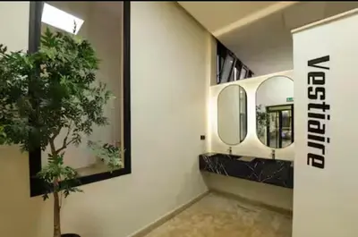 a bathroom with a mirror and a potted plant at Luxurious 2 Bedrooms in Gueliz Pool View in Marrakech