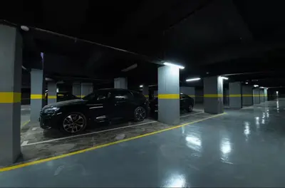 a black car parked in a parking garage at Luxurious 2 Bedrooms in Gueliz Pool View in Marrakech