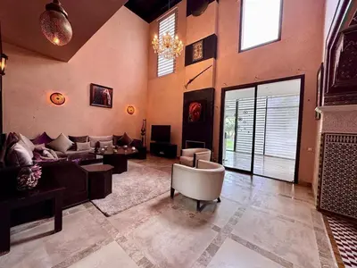 a large living room with a couch and a table at Marrakech Luxury Escape Full Villa Pool & Garden in Sraghna