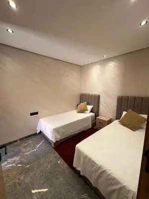 a bedroom with two beds at City Chic New build Apartment in Marrakech