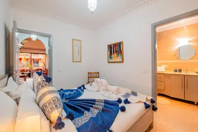 a living room with a couch and a sink at 1-Bedroom Apartment in Guéliz Center , 10 Min Jemaa El-Fna in Marrakech