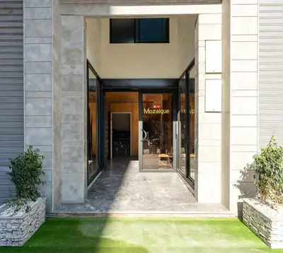 a entrance to a museum with a glass door at Le Sahara Retreat - 2 prs - Piscine - Wifi in Marrakech