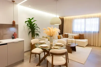 a kitchen and living room with a table and chairs at Le Sahara Retreat - 2 prs - Piscine - Wifi in Marrakech