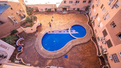 an overhead view of a swimming pool in the middle of a building at Appartement Chic avec Piscine au Cœur de Gueliz in Marrakech