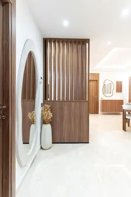 a lobby with a wooden door and a table at Menara Suite Harmonie , Terrasse et Piscine in Marrakech