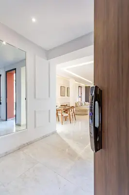 an open door to a living room with a table at Private Luxury Penthouse Marrakech with Jacuzzi & Pool in Marrakech