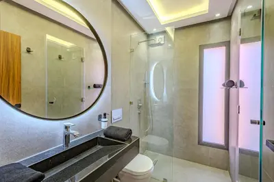 a bathroom with a mirror and a toilet and a shower at Private Luxury Penthouse Marrakech with Jacuzzi & Pool in Marrakech