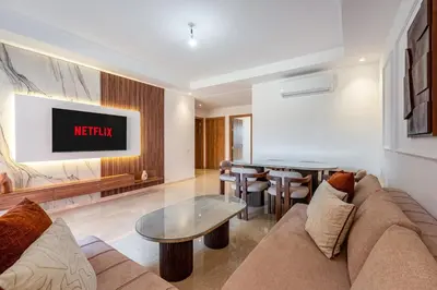 a living room with a couch and a table at Noria Golf Marrakech pool view 2 bedrooms garden in Marrakech