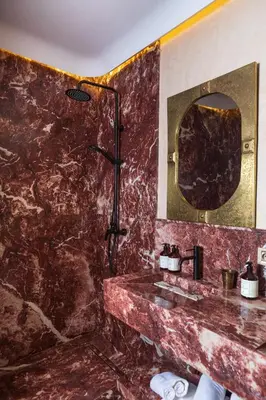 a bathroom with a sink and a mirror at Riad Dar Shala in Marrakech