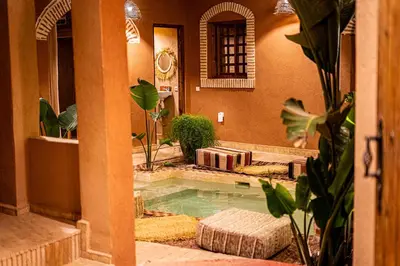 a house with a swimming pool in a courtyard at Riad Amara Private pool breakfast in Marrakech