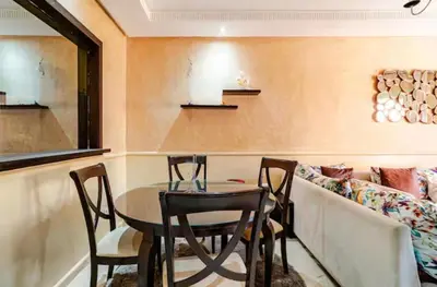 a dining room with a table and chairs at Appartement marrakech garden in Marrakech