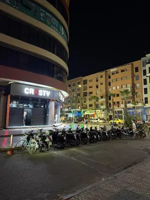 a row of motorcycles parked in front of a building at Gueliz Bright & Modern 2BR 2 Balcons in Marrakech