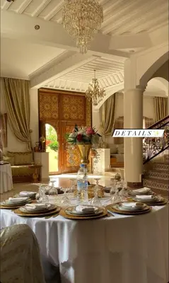 a table in a room with a white table cloth at Welcome to Riad Glam Marrakech in Marrakech