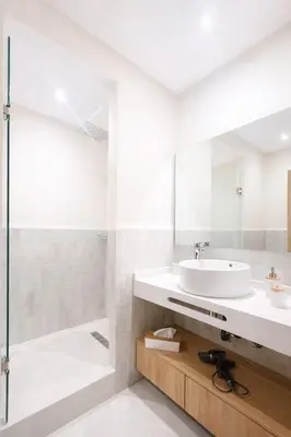 a bathroom with a sink and a shower at Luxury 2 Bedroom Apartment Pool & Garden Wifi in Marrakech