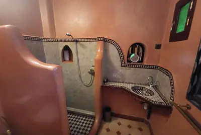 a bathroom with a shower and a sink at Riad Granada in Marrakech