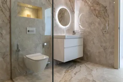 a bathroom with a toilet and a glass shower at THE ESTATE - Marrakech in Marrakech