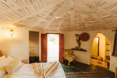 a bedroom with a bed and a ceiling fan at Oasis Garden Marrakech in Marrakech