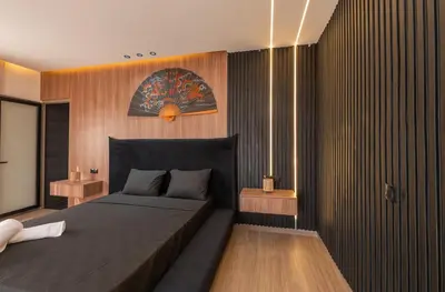 a bedroom with a bed and wooden walls at Villa Soliya 4 Rooms with private pool in Marrakech