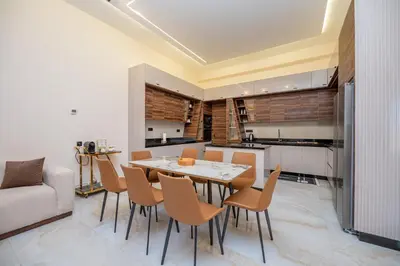 a kitchen and dining room with a table and chairs at Villa Soliya 4 Rooms with private pool in Marrakech