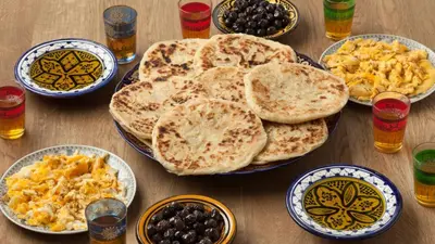 a table with plates of food and bowls of breakfast foods at Villa Soliya 4 Rooms with private pool in Marrakech
