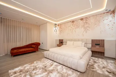 a bedroom with a white bed and a couch at Villa Soliya 4 Rooms with private pool in Marrakech