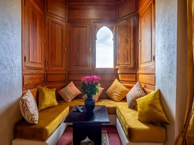 a living room with a couch and a window at Hôtel Boutique RAM SPA in Marrakech