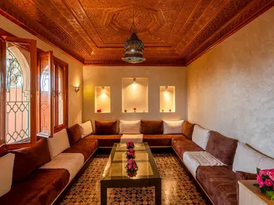 a living room with a couch and a table at Hôtel Boutique RAM SPA in Marrakech