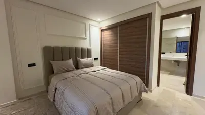 a bedroom with a bed and a large mirror at Stylish 1-Bed Retreat in Marrakech