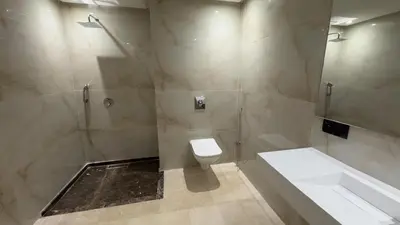 a bathroom with a shower and a toilet and a tub at Stylish 1-Bed Retreat in Marrakech
