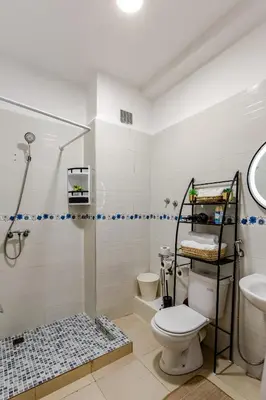 a bathroom with a shower and a toilet and a sink at Spacious Can 2025 Iptv Guéliz 7 min away in Marrakech