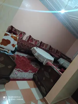 a room with a bunch of pillows on the floor at Appartement proche de l'airoport in Marrakech