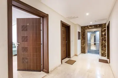 a hallway with a door in a house at Résidence jnan ali 4 Marrakech in Marrakech