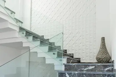 a glass staircase with a vase sitting on a counter at Villa Sunstone Marrakech in Marrakech