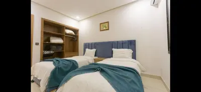 a group of three beds in a room at Modern 3-Bed retreat in Gueliz near Train station in Marrakech