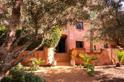 a house with a staircase leading to the front door at River Palm, bel appartement 2 ch Piscine résidence in Marrakech